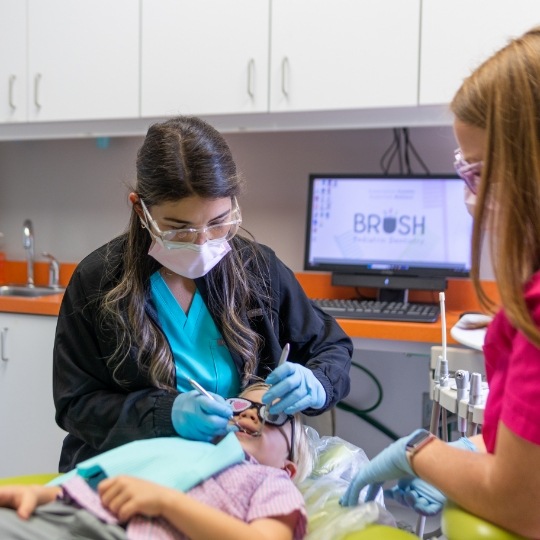 Young girl grinding during dental checkup