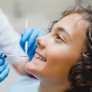 A child having their teeth cleaned