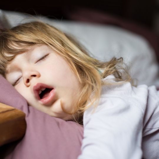 Young girl sleeping with her mouth open