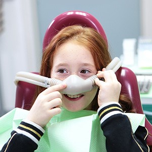 Young girl wearing nasal mask for nitrous oxide